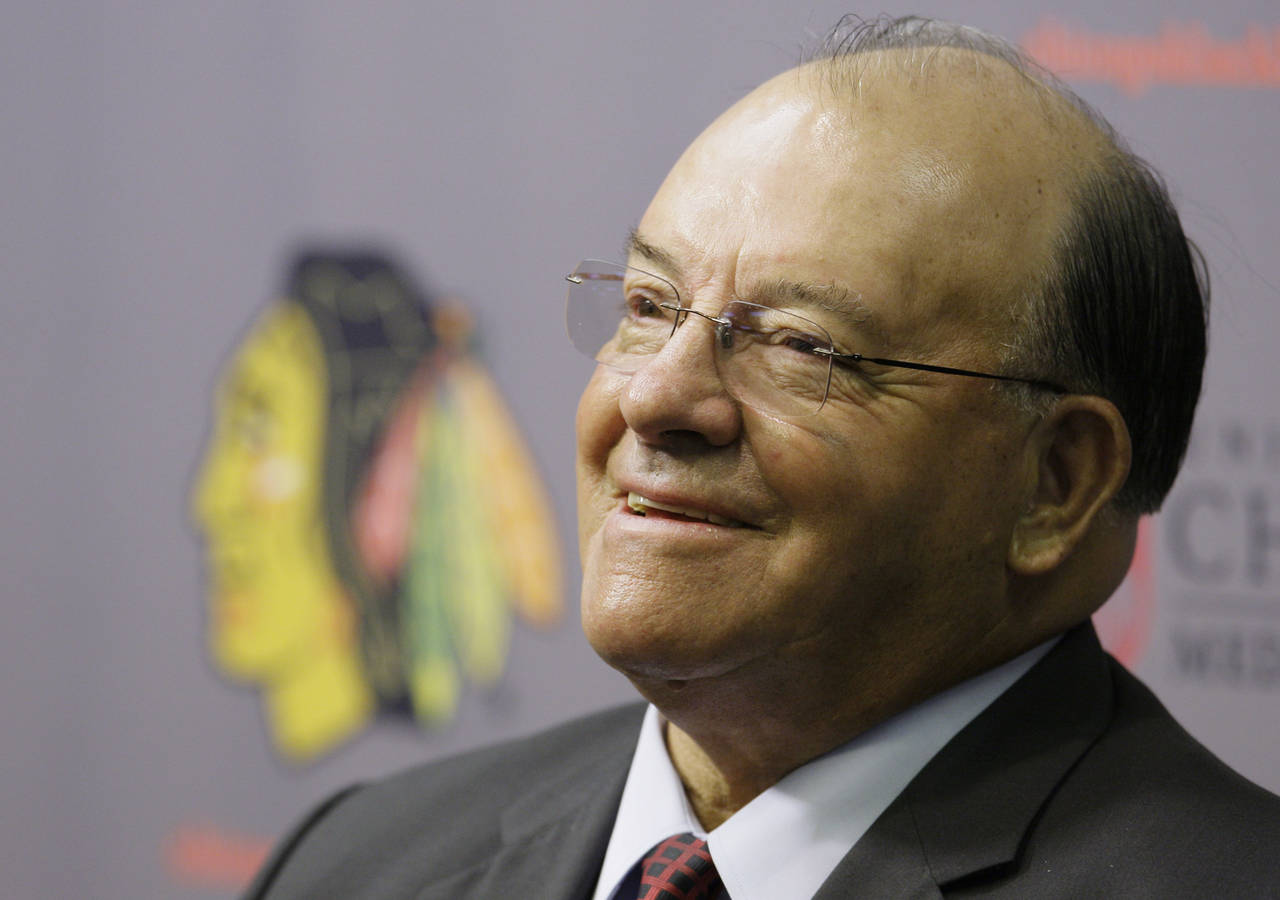 FILE - Eleven-time Stanley Cup champion Scotty Bowman answers questions as he is introduced as the ...