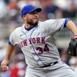 
              New York Mets relief pitcher Tommy Hunter (34) works the eighth inning of a baseball game against the Atlanta Braves Wednesday, July 13, 2022, in Atlanta. The Mets beat the Braves 7-3. (AP Photo/John Bazemore)
            