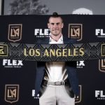 
              Gareth Bale poses for photos after being introduced as a new member of the Los Angeles FC MLS soccer club Monday, July 11, 2022, in Los Angeles. (AP Photo/Marcio Jose Sanchez)
            