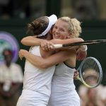 
              Barbora Krejcikova of the Czech Republic, left and Katerina Siniakova of the Czech Republic react after winning against Belgium's Elise Mertens and China's Shuai Zhang, in the final of the women's doubles on day fourteen of the Wimbledon tennis championships in London, Sunday, July 10, 2022. (AP Photo/Gerald Herbert)
            