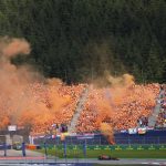 
              Fans cheer on Red Bull driver Max Verstappen, of the Netherlands, during the Austrian F1 Grand Prix at the Red Bull Ring racetrack in Spielberg, Austria, Sunday, July 10, 2022. (AP Photo/Matthias Schrader)
            