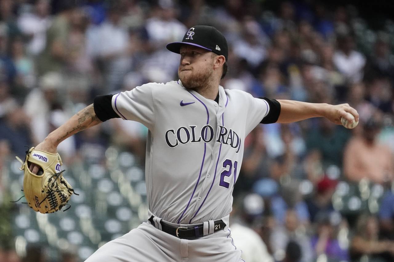 Colorado Rockies starting pitcher Kyle Freeland throws during the first inning of a baseball game a...