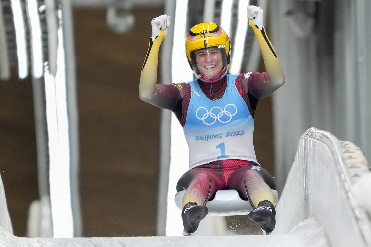 FILE - Natalie Geisenberger, of Germany, celebrates winning the gold medal in luge women's singles ...