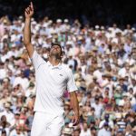 
              Serbia's Novak Djokovic celebrates beating Australia's Nick Kyrgios in the final of the men's singles on day fourteen of the Wimbledon tennis championships in London, Sunday, July 10, 2022. (AP Photo/Kirsty Wigglesworth)
            