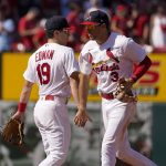 
              St. Louis Cardinals' Tommy Edman and Dylan Carlson (3) celebrate a 4-3 victory over the Philadelphia Phillies in a baseball game Sunday, July 10, 2022, in St. Louis. (AP Photo/Jeff Roberson)
            