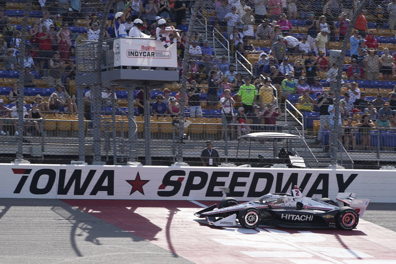 Josef Newgarden crosses the finish line as he wins the IndyCar Series auto race Saturday, July 23, ...