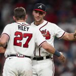 
              Atlanta Braves first baseman Matt Olson (28) and third baseman Austin Riley (27) embrace after defeating the New York Mets in a baseball game Tuesday, July 12, 2022, in Atlanta. (AP Photo/John Bazemore)
            