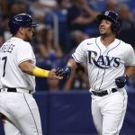 
              Tampa Bay Rays' Francisco Mejia, right, celebrates with teammate Issac Paredes after scoring against the Boston Red Sox during the sixth inning of a baseball game Tuesday July 12, 2022, in St. Petersburg, Fla. (AP Photo/Scott Audette)
            