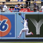 
              Los Angeles Dodgers center fielder Trayce Thompson makes a leaping catch on a line drive from Washington Nationals' Luis Garcia during the fifth inning of a baseball game Wednesday, July 27, 2022, in Los Angeles. (AP Photo/Marcio Jose Sanchez)
            