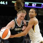 
              Las Vegas Aces' Kiah Stokes, right, pressures Chicago Sky's Emma Meesseman during the second half of the WNBA Commissioner's Cup basketball game Tuesday, July 26, 2022, in Chicago. The Aces won 93-83. (AP Photo/Charles Rex Arbogast)
            
