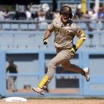 
              San Diego Padres' Ha-Seong Kim celebrates as he rounds first after hitting a two-run home run during the ninth inning of a baseball game against the Los Angeles Dodgers Sunday, July 3, 2022, in Los Angeles. (AP Photo/Mark J. Terrill)
            