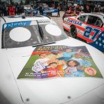 
              This photo provided by LakeSide Media shows the hood of NASCAR driver Brandon Brown’s Camaro featuring the cover design for “Brandon Spots His Sign,” a children’s book written by Sheletta Brundidge in honor of her son, Brandon Brundidge. Brown drove this Camaro at his Xfinity Series race Saturday at Road America in Elkhart Lake, Wis. (Garrett Pace/LakeSide Media)
            