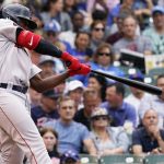 
              Boston Red Sox's Jackie Bradley Jr., hits a three-run double during the second inning of a baseball game against the Chicago Cubs in Chicago, Friday, July 1, 2022. (AP Photo/Nam Y. Huh)
            