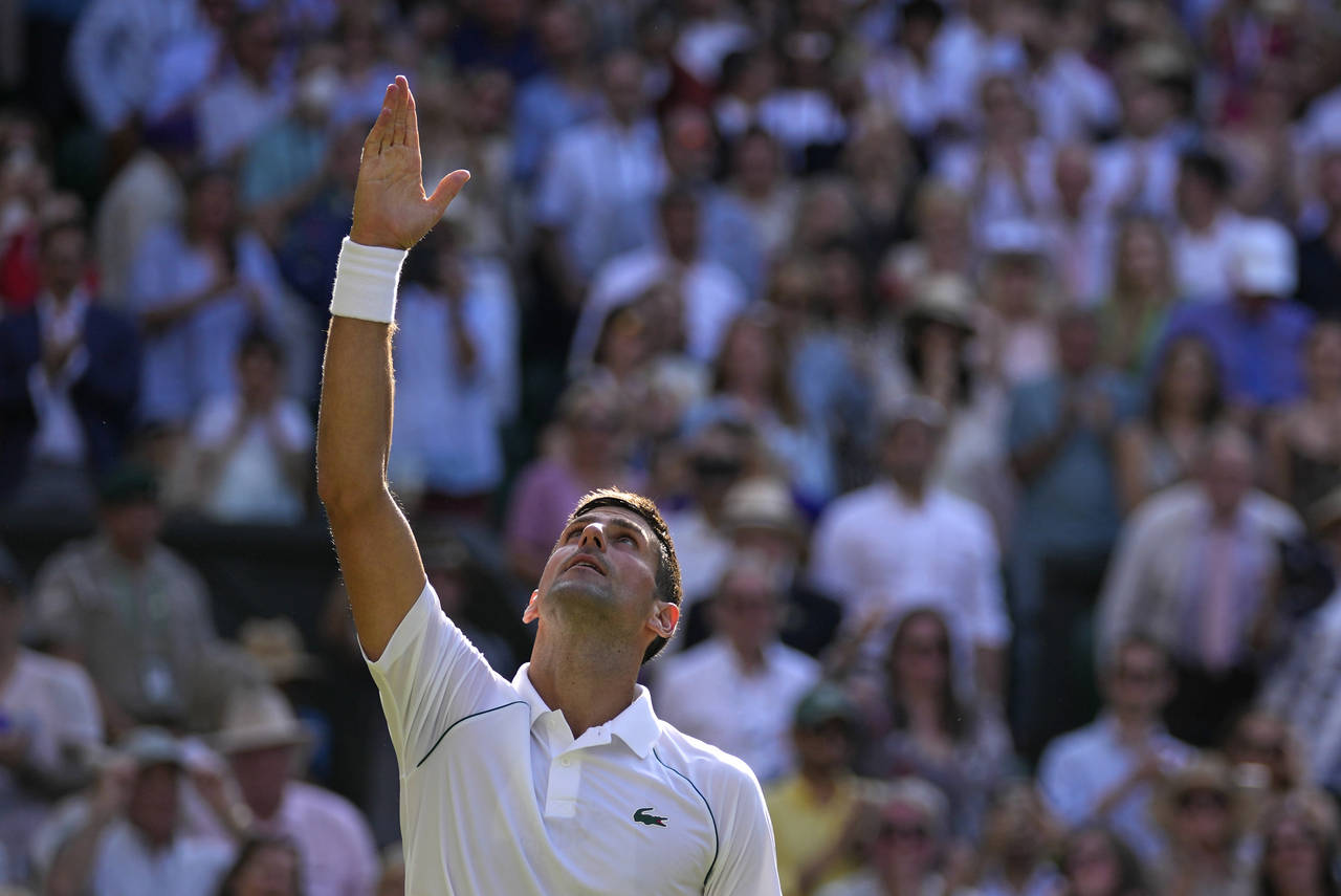 Serbia's Novak Djokovic celebrates after beating Britain's Cameron Norrie in a men's singles semifi...