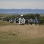 
              Scottie Scheffler of the US after playing a shot on the 14th fairway during the third round of the British Open golf championship on the Old Course at St. Andrews, Scotland, Saturday July 16, 2022. (AP Photo/Alastair Grant)
            