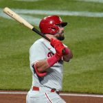 
              Philadelphia Phillies' Kyle Schwarber follows through on an RBI-single off Pittsburgh Pirates relief pitcher Wil Crowe during the seventh inning of a baseball game in Pittsburgh, Friday, July 29, 2022. (AP Photo/Gene J. Puskar)
            