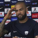 
              Brazilian Dani Alves salutes as he is presented as a new member of the Pumas UNAM, in Mexico City, Saturday, July 23, 2022.  (AP Photo/Marco Ugarte)
            