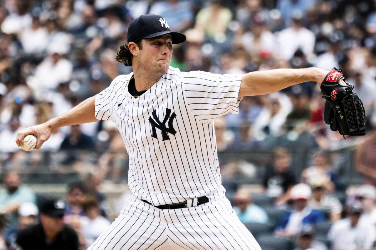 New York Yankees starting pitcher Gerrit Cole throws during the first inning of a baseball game aga...