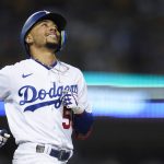 
              Los Angeles Dodgers' Mookie Betts (50) reacts as he grounds out to shortstop during the sixth inning of a baseball game against the Chicago Cubs in Los Angeles, Friday, July 8, 2022. (AP Photo/Ashley Landis)
            