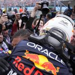
              Red Bull driver Max Verstappen of the Netherlands celebrates with his team after winning the Hungarian Formula One Grand Prix at the Hungaroring racetrack in Mogyorod, near Budapest, Hungary, Sunday, July 31, 2022. (AP Photo/Darko Bandic)
            