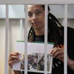 
              WNBA star and two-time Olympic gold medalist Brittney Griner holds images standing in a cage at a court room prior to a hearing, in Khimki just outside Moscow, Russia, Wednesday, July 27, 2022. American basketball star Brittney Griner returned Wednesday to a Russian courtroom for her drawn-out trial on drug charges that could bring her 10 years in prison of convicted. (AP Photo/Alexander Zemlianichenko, Pool)
            