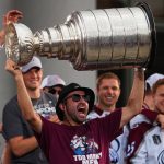 
              Colorado Avalanche center Nazem Kadri hoists the Stanley Cup at a rally for the NHL hockey champions Thursday, June 30, 2022, in Denver. (AP Photo/Jack Dempsey)
            