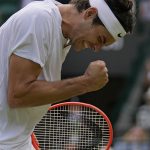 
              Taylor Fritz of the US reacts after winning a point against Australia's Jason Kubler in a men's singles fourth round match on day eight of the Wimbledon tennis championships in London, Monday, July 4, 2022. (AP Photo/Alastair Grant)
            