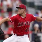 
              Los Angeles Angels starting pitcher Reid Detmers throws to the plate during the second inning of a baseball game against the Texas Rangers Sunday, July 31, 2022, in Anaheim, Calif. (AP Photo/Mark J. Terrill)
            