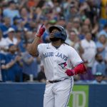 
              Toronto Blue Jays first baseman Vladimir Guerrero Jr. (27) celebrates after his home run against the Philadelphia Phillies during the fourth inning of a baseball game, Wednesday, July 13, 2022 in Toronto. (Christopher Katsarov/The Canadian Press via AP)
            