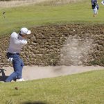
              Colin Morikawa from the US plays out of the bunker on the 1st hole during day one of the Scottish Open at The Renaissance Club, North Berwick, Scotland, Thursday July 7, 2022. (Steve Welsh/PA via AP)
            