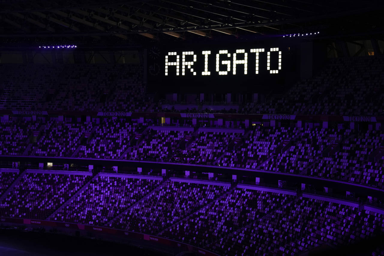 FILE - "Ariagato" is displayed at the end of the closing ceremony in the Olympic Stadium at the 202...