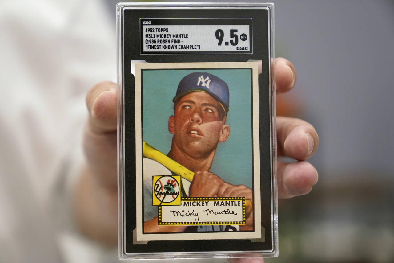 A Mickey Mantle baseball card is displayed at Heritage Auctions in Dallas, Thursday, July 21, 2022....