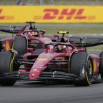 
              Ferrari driver Carlos Sainz of Spain, foreground, and Ferrari driver Charles Leclerc of Monaco steer thier cars during the British Formula One Grand Prix at the Silverstone circuit, in Silverstone, England, Sunday, July 3, 2022. (AP Photo/Frank Augstein)
            
