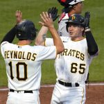 
              Pittsburgh Pirates' Jack Suwinski (65) is greeted by Bryan Reynolds after hitting a two-run home run off New York Yankees starting pitcher Jameson Taillon during the fourth inning of a baseball game in Pittsburgh, Tuesday, July 5, 2022. (AP Photo/Gene J. Puskar)
            