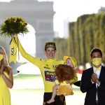 
              Tour de France winner Denmark's Jonas Vingegaard, wearing the overall leader's yellow jersey, celebrates on the podium after the twenty-first stage of the Tour de France cycling race over 116 kilometers (72 miles) with start in Paris la Defense Arena and finish on the Champs Elysees in Paris, France, Sunday, July 24, 2022. (Etienne Garnier/Pool Photo via AP)
            