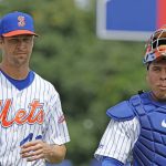 
              New York Mets' Jacob deGrom walks onto the field with catcher Francisco Álvarez to pitch for triple-A Syracuse against Omaha in what could be his last minor league rehab outing before rejoining New York's rotation, in Syracuse, N.Y., Wednesday, July 27, 2022. (Scott Schild/The Post-Standard via AP)
            