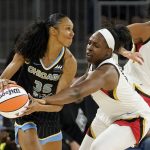 
              Las Vegas Aces' Chelsea Gray, right, pressures Chicago Sky's Rebekah Gardner during the first half of the WNBA Commissioner's Cup basketball game Tuesday, July 26, 2022, in Chicago. (AP Photo/Charles Rex Arbogast)
            