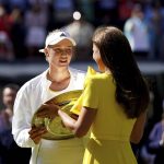 
              Kazakhstan's Elena Rybakina is presented with the trophy by Kate, Duchess of Cambridge after beating Tunisia's Ons Jabeur to win the final of the women’s singles on day thirteen of the Wimbledon tennis championships in London, Saturday, July 9, 2022. (Zac Goodwin/PA via AP)
            