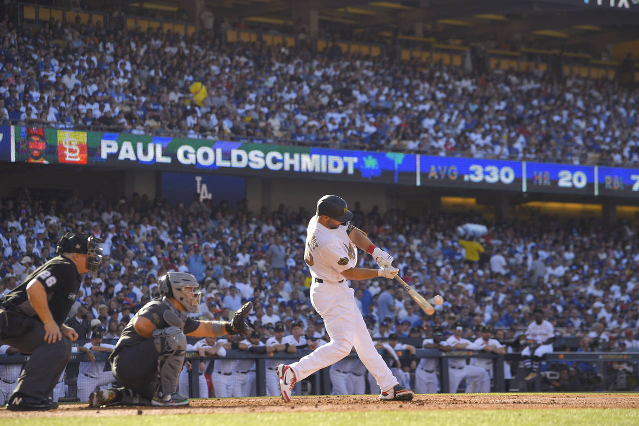 National League's Paul Goldschmidt, of the St. Louis Cardinals, connects for a solo home run off Am...