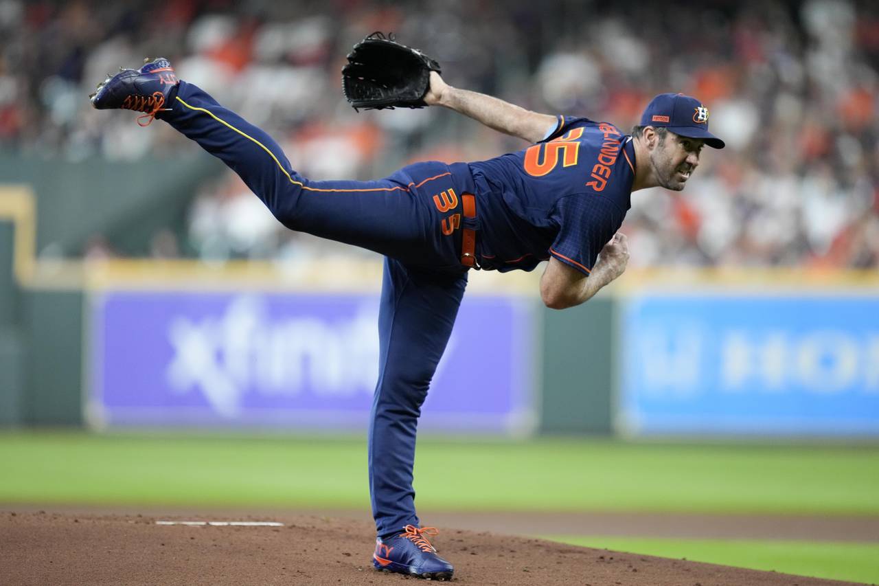 Houston Astros starting pitcher Justin Verlander follows through on a pitch during the first inning...