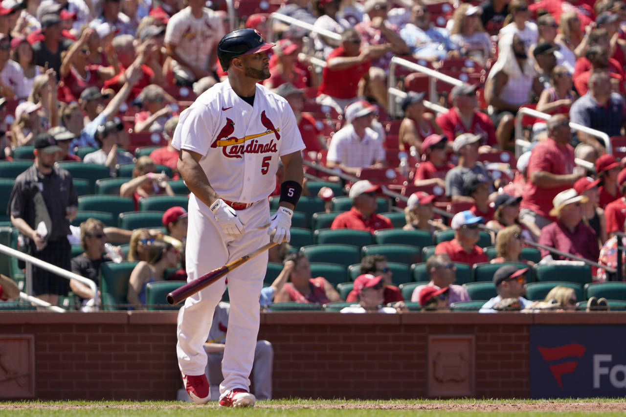 St. Louis Cardinals' Albert Pujols watches his solo home run during the sixth inning of a baseball ...