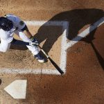 
              Milwaukee Brewers' Keston Hiura hits an RBI single during the sixth inning of a baseball game against the Pittsburgh Pirates Saturday, July 9, 2022, in Milwaukee. (AP Photo/Morry Gash)
            