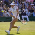 
              Australia's Ajla Tomljanovic returns the ball to France's Alize Cornet during a women's singles fourth round match on day eight of the Wimbledon tennis championships in London, Monday, July 4, 2022. (AP Photo/Kirsty Wigglesworth)
            