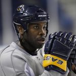 
              FILE - Buffalo Sabres' Michael Grier is shown during NHL hockey practice in Buffalo, N.Y., Tuesday, April 13, 2010. The San Jose Sharks have hired longtime NHL forward Mike Grier to become the first Black general manager in NHL history. Grier fills the spot that opened when Doug Wilson stepped away for health reasons earlier this year in a barrier-breaking move for the league on Tuesday, July 5, 2022. (AP Photo/David Duprey, File)
            