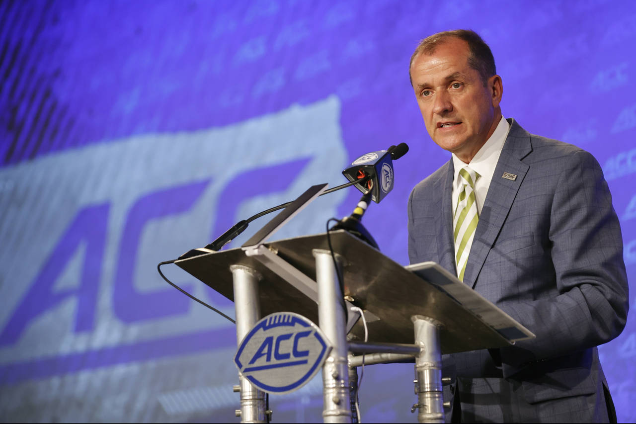 Atlantic Coast Conference commissioner Jim Phillips speaks during an NCAA college football news con...