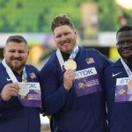 
              Gold medalist Ryan Crouser, of the United States, center, stands on the podium with silver medalist Joe Kovacs, of the United States, left, and bronze medalist Josh Awotunde, of the United States, during a medal ceremony for the men's shot put final at the World Athletics Championships on Sunday, July 17, 2022, in Eugene, Ore. (AP Photo/David J. Phillip)
            