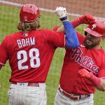 
              Philadelphia Phillies' Kyle Schwarber, right, celebrates as he returns to the dugout with Alec Bohm after hitting a solo home run off Pittsburgh Pirates starting pitcher JT Brubaker during the fifth inning tof a baseball game in Pittsburgh, Sunday, July 31, 2022. (AP Photo/Gene J. Puskar)
            