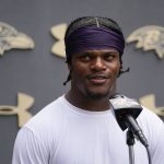 
              Baltimore Ravens quarterback Lamar Jackson talks to reporters during the team's NFL football training camp, Thursday, July 28, 2022, in Owings Mills, Md. (AP Photo/Julio Cortez)
            