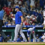 
              Chicago Cubs manager David Ross, center, is elected by umpire CB Bucknor during the 10th inning of the team's baseball game against the Philadelphia Phillies, Saturday, July 23, 2022, in Philadelphia. (AP Photo/Matt Rourke)
            