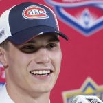 
              Juraj Slafkovsky smiles during a news conference after being selected as the first overall pick by the Montreal Canadiens during the first round of the NHL hockey draft in Montreal, Thursday, July 7, 2022. (Graham Hughes/The Canadian Press via AP)
            